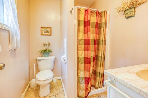 a bathroom with a toilet and a shower at Moosehead Condo Unit #5 in Rockwood