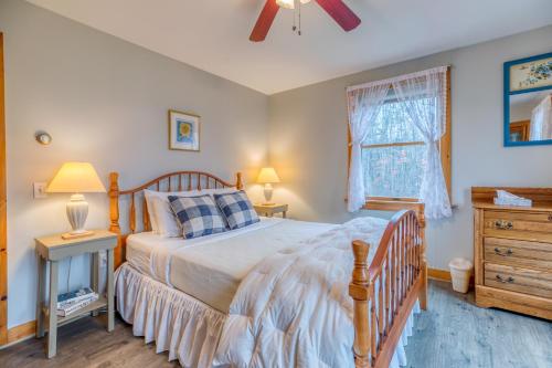 a bedroom with a bed and a dresser and a window at Cappy's Retreat in Stockton Springs