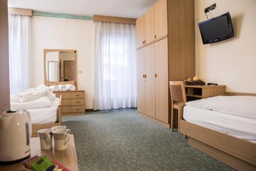 Postel nebo postele na pokoji v ubytování Active Hotel Rosat
