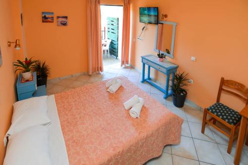 Letto o letti in una camera di Panos Apartments