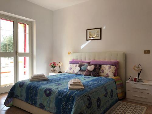 Postel nebo postele na pokoji v ubytování Appartamento in Villa Andreina