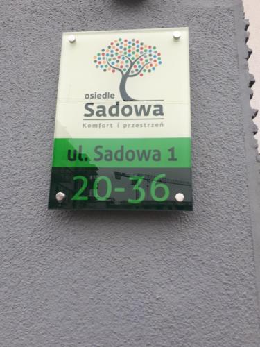 APARTAMENT-SADOWAに飾ってある許可証、賞状、看板またはその他の書類