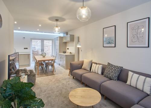 a living room with a couch and a table at Host & Stay - Hoggarths Retreat in Whitby