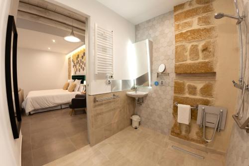 Et badeværelse på VITORES BOUTIQUE APARTAMENTOS Rincón del Regidor