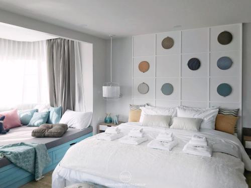 Кровать или кровати в номере Stay in Style at Nimman R918