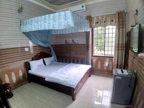 Кровать или кровати в номере Hoa Phuong Guesthouse