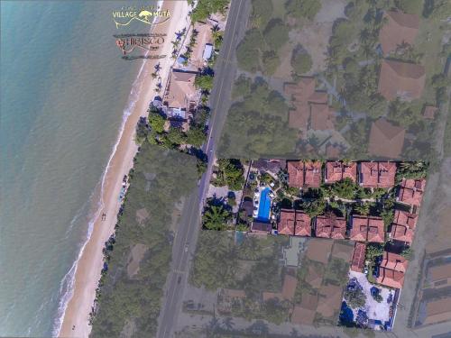 an aerial view of the beach and condos at Village Muta in Porto Seguro