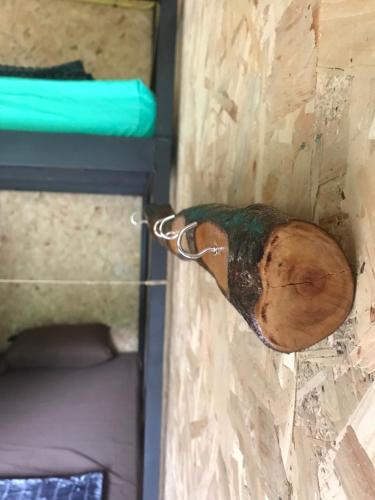 a wooden object attached to the side of a wall at HomeHostel in Ko Chang