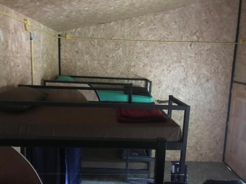 a small room with two bunk beds in it at HomeHostel in Ko Chang