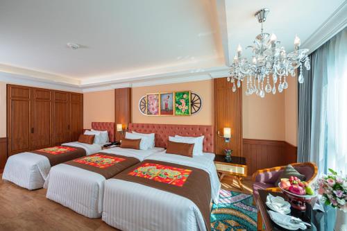 Letto o letti in una camera di The Empress Premier Chiang Mai