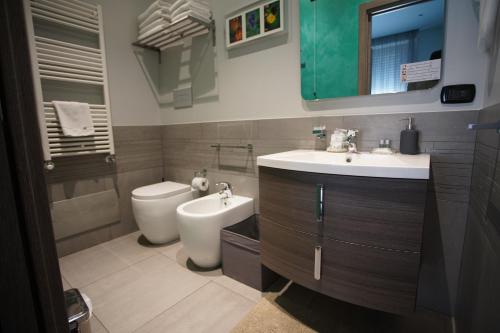 a bathroom with a sink and a toilet at La Dimora in Catania