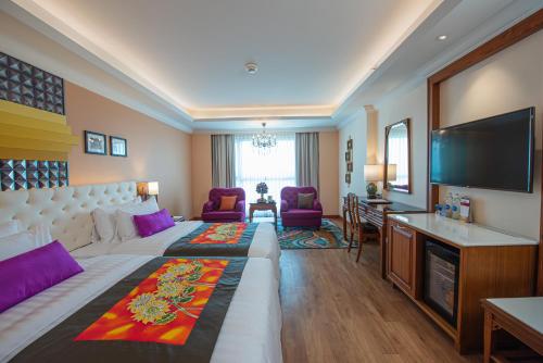 Letto o letti in una camera di The Empress Premier Chiang Mai