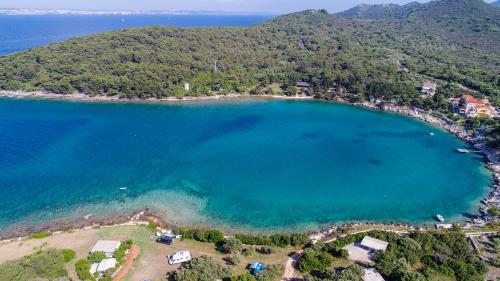 an aerial view of a beach with blue water at Apartment Roko in Ugljan