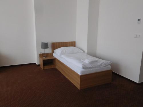Postel nebo postele na pokoji v ubytování Hotel Fabrika