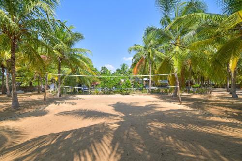 a shadow of a palm tree on a soccer field at De Silva Palm Resort in Kalpitiya