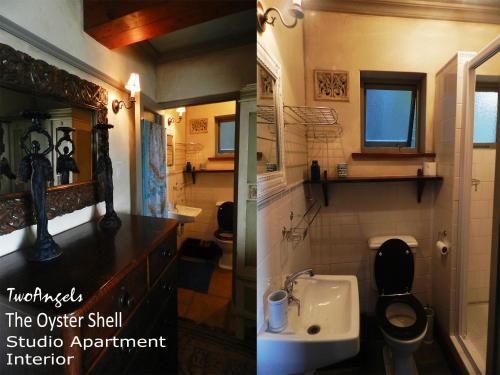 a bathroom with a toilet and a sink at TwoAngels in Knysna