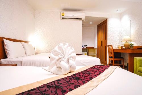 Postel nebo postele na pokoji v ubytování Neptuna Hotel