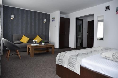 Postel nebo postele na pokoji v ubytování Hotel Magurele