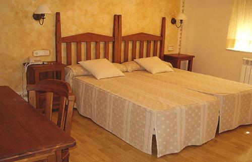 Säng eller sängar i ett rum på La Becera