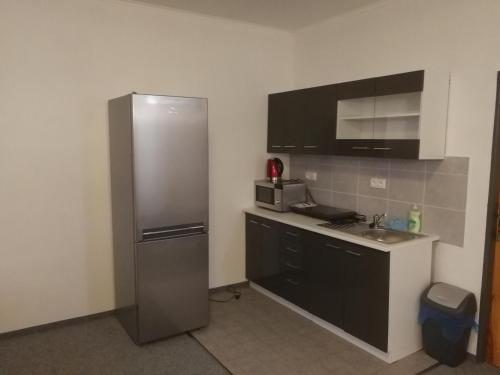 A cozinha ou cozinha compacta de Hotel - penzion M&M