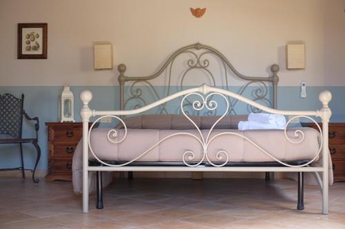 Ένα ή περισσότερα κρεβάτια σε δωμάτιο στο Agriturismo Podere Farnesiana