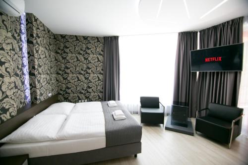 Ένα ή περισσότερα κρεβάτια σε δωμάτιο στο Hotel U Kostela