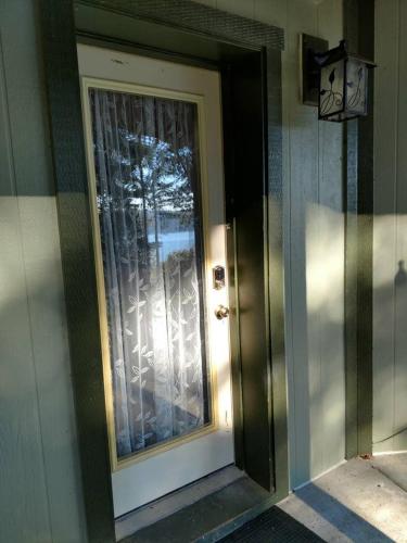 a door with a window on the side of a building at Sunrise Suite on the Sound in Anacortes