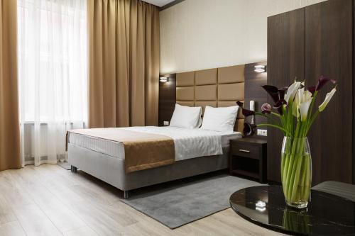 A bed or beds in a room at Parallel Hotel & Conference Krasnodar