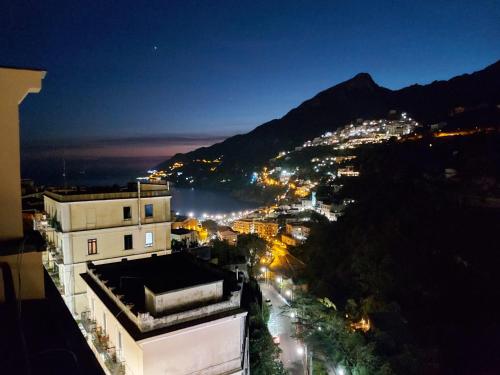 a view of a city at night at Casa Panorama Amalfi Coast in Vietri sul Mare