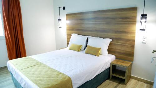 Postel nebo postele na pokoji v ubytování Hamilton Suites & Appart