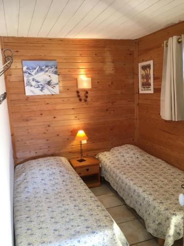 Katil atau katil-katil dalam bilik di Appartements dans Chalet
