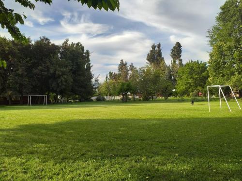 a large grass field with a soccer goal at Villa Rosa House in Pinto