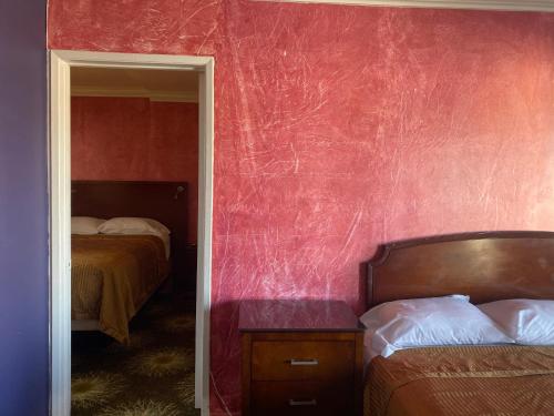 Letto o letti in una camera di Villa Park Motel