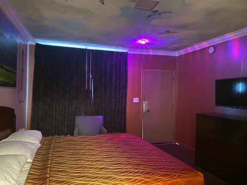 Letto o letti in una camera di Villa Park Motel