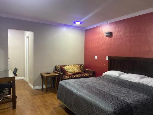 Letto o letti in una camera di Villa Park Motel