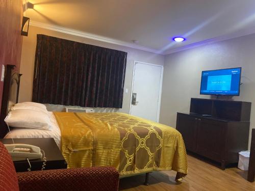 Letto o letti in una camera di Villa Park Motel