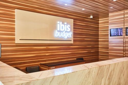 a sign on the wall of a doctors lobby at ibis budget Singapore Crystal in Singapore