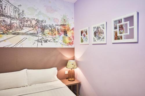 Ένα ή περισσότερα κρεβάτια σε δωμάτιο στο ibis budget Singapore Joo Chiat