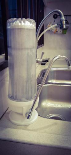 a container of paper towels sitting next to a sink at The Floral Home in Melaka
