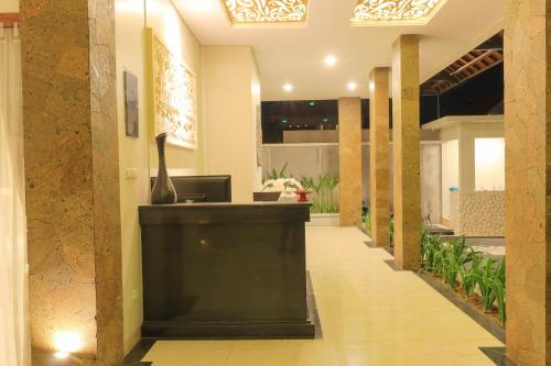 a lobby of a hotel with a reception desk at Linda Villa 2 in Sanur