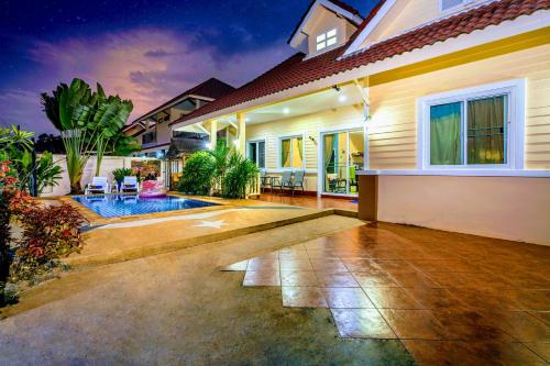 a house with a swimming pool in the backyard at Relax private Pool Villas - 4 bedroom villas in Ao Nang Beach