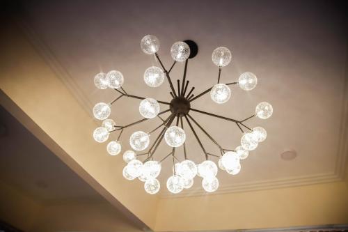 a chandelier hanging from a ceiling in a room at Bella Villa Coron in Coron