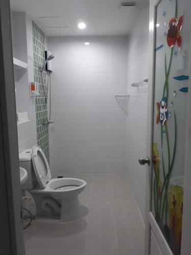 a bathroom with a toilet and a shower stall at B&B NAMO PHUKET in Kathu