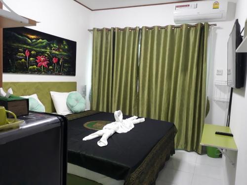 Postel nebo postele na pokoji v ubytování B&B NAMO PHUKET