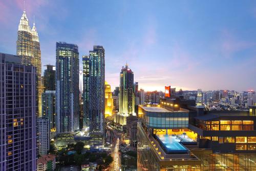 a city skyline at night with tall buildings at ibis Kuala Lumpur City Centre in Kuala Lumpur