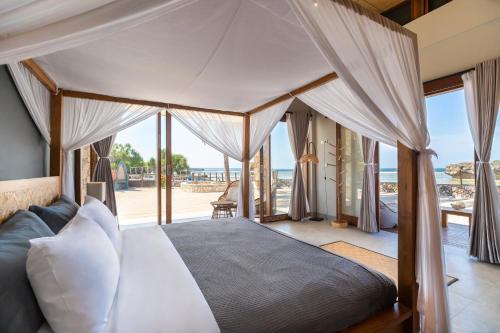Postel nebo postele na pokoji v ubytování Manduna Resort