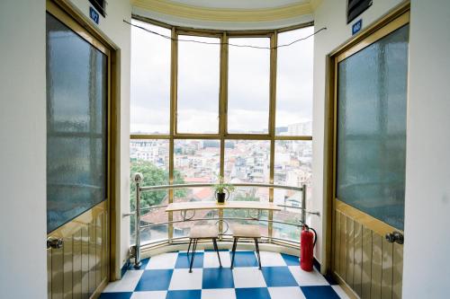 a balcony with a view of a city at Nụ Cười Xinh in Da Lat