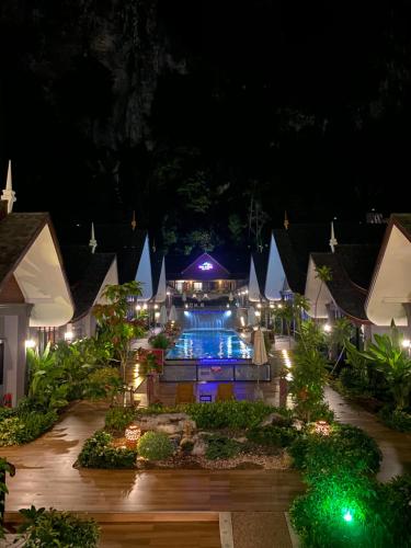 a resort with a swimming pool at night at The Scene Cliff View Villas in Ao Nang Beach