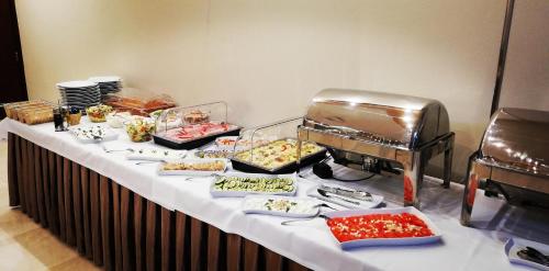 a buffet table with many different types of food at Hotel Biały in Wałbrzych