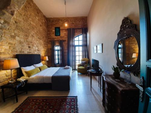 Katil atau katil-katil dalam bilik di Al Qualaa Boutique Hotel